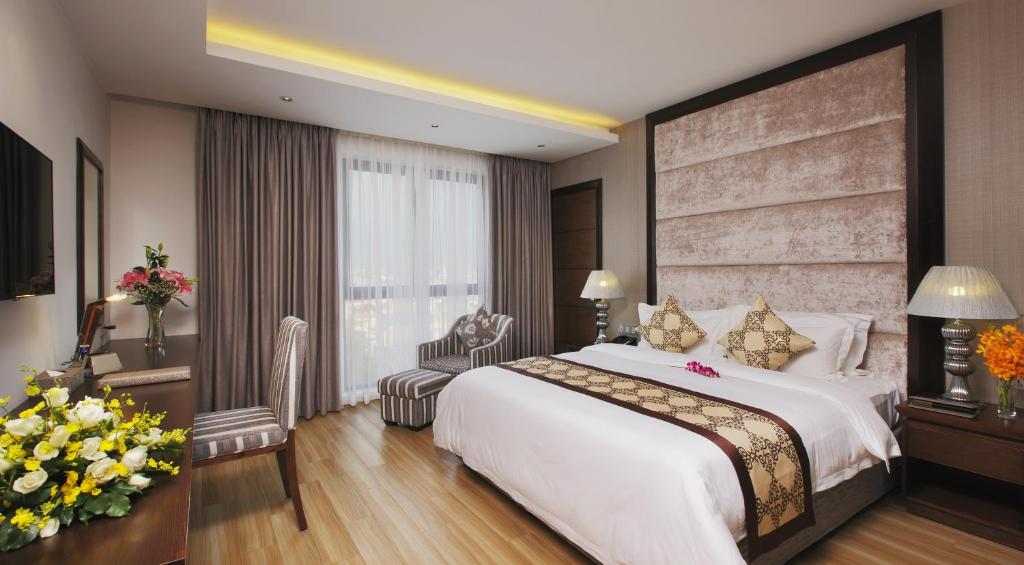 Postel nebo postele na pokoji v ubytování Athena Hotel