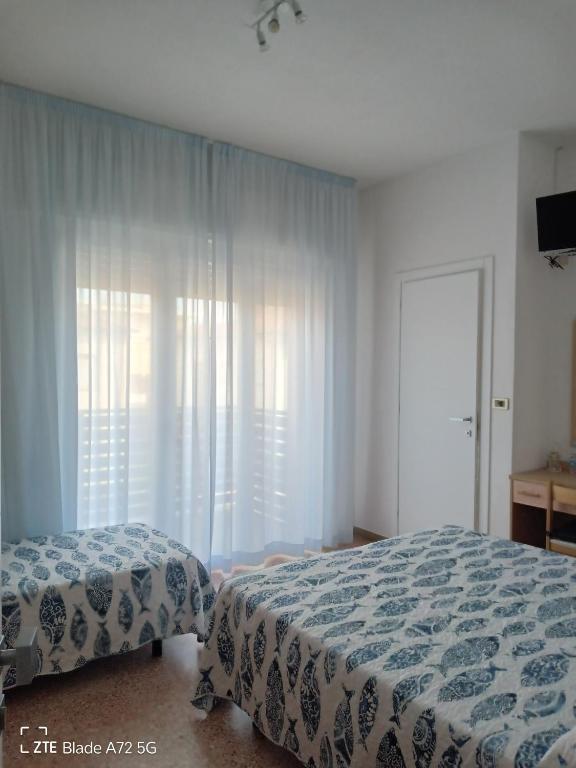 Postel nebo postele na pokoji v ubytování Ninfea rooms
