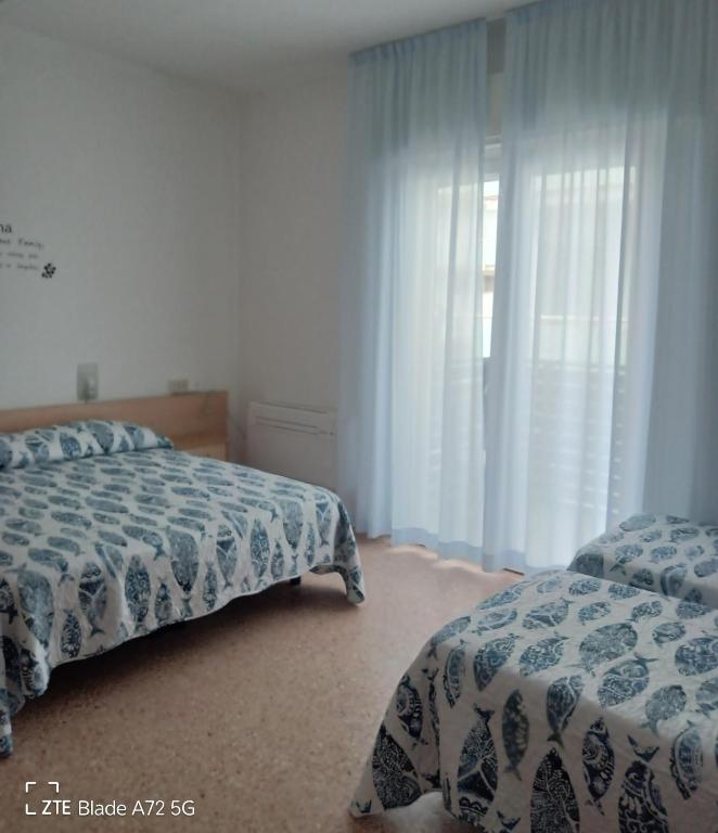 Postel nebo postele na pokoji v ubytování Ninfea rooms