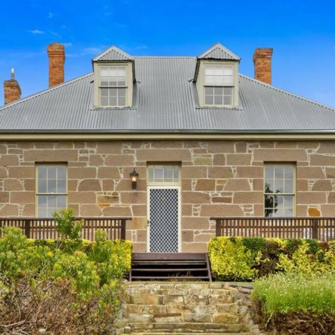 a large brick house with two windows on it at LUCAS Street in Kingston