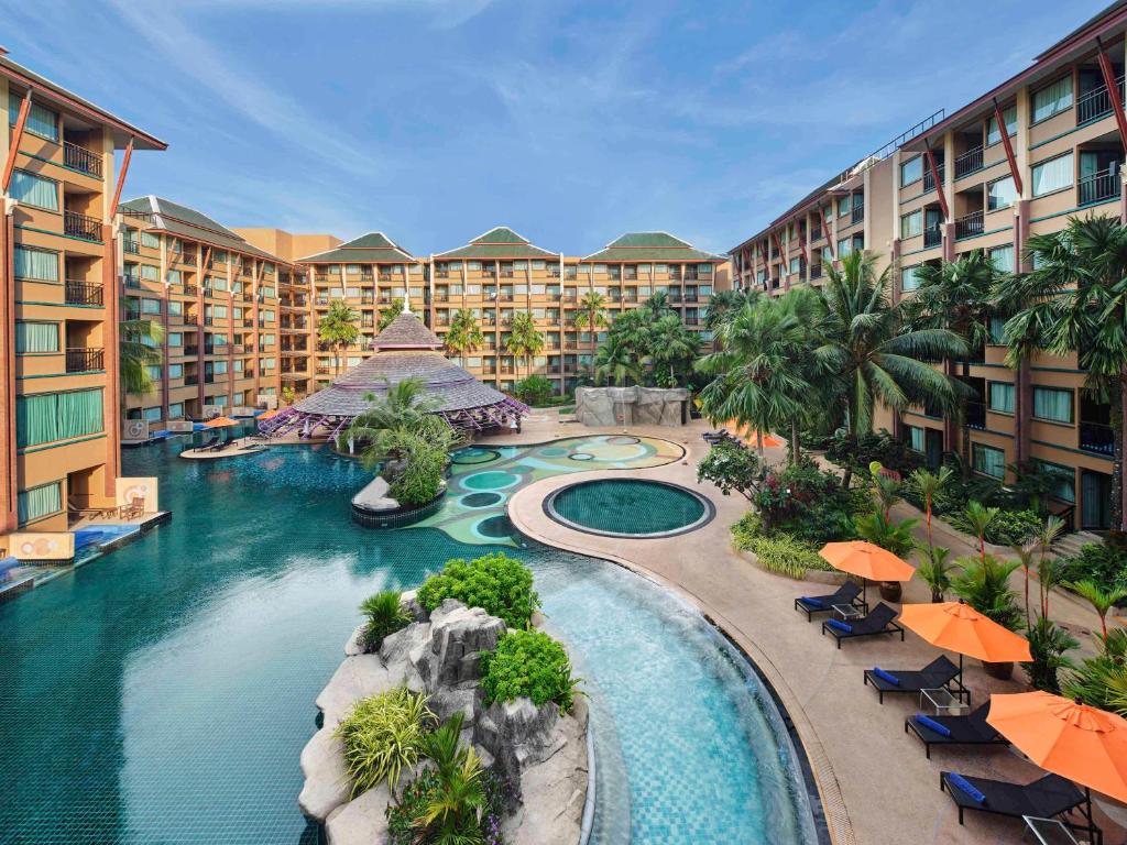 an aerial view of a resort with a swimming pool at Novotel Phuket Vintage Park Resort in Patong Beach