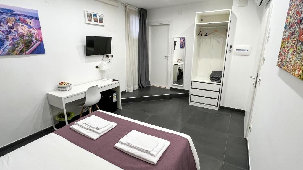 Łóżko lub łóżka w pokoju w obiekcie Soave Rooms