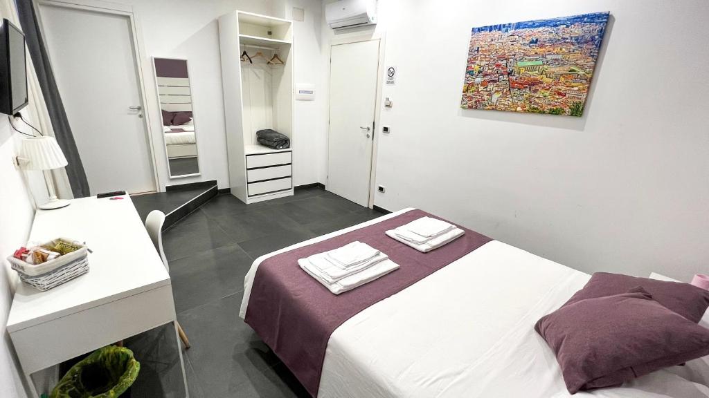 Łóżko lub łóżka w pokoju w obiekcie Soave Rooms