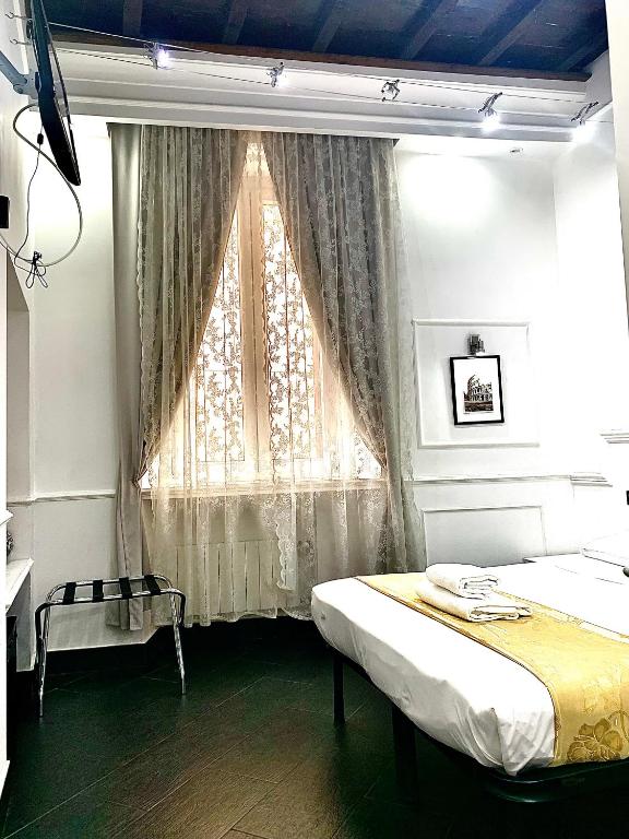 A bed or beds in a room at L'antica Locanda Dell'Orso