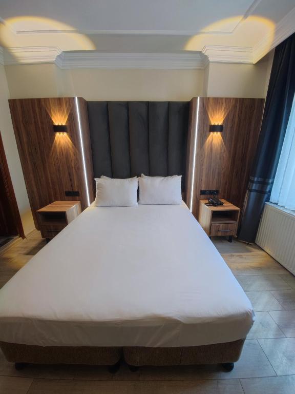 Postel nebo postele na pokoji v ubytování Star Hotel