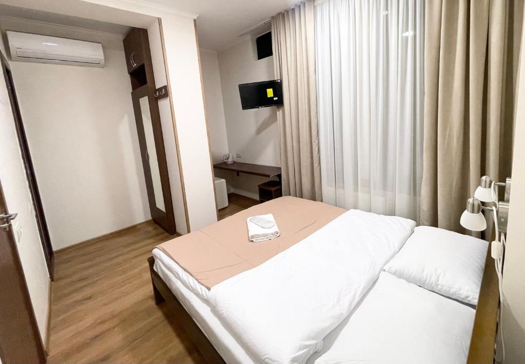 Postel nebo postele na pokoji v ubytování ART family hotel