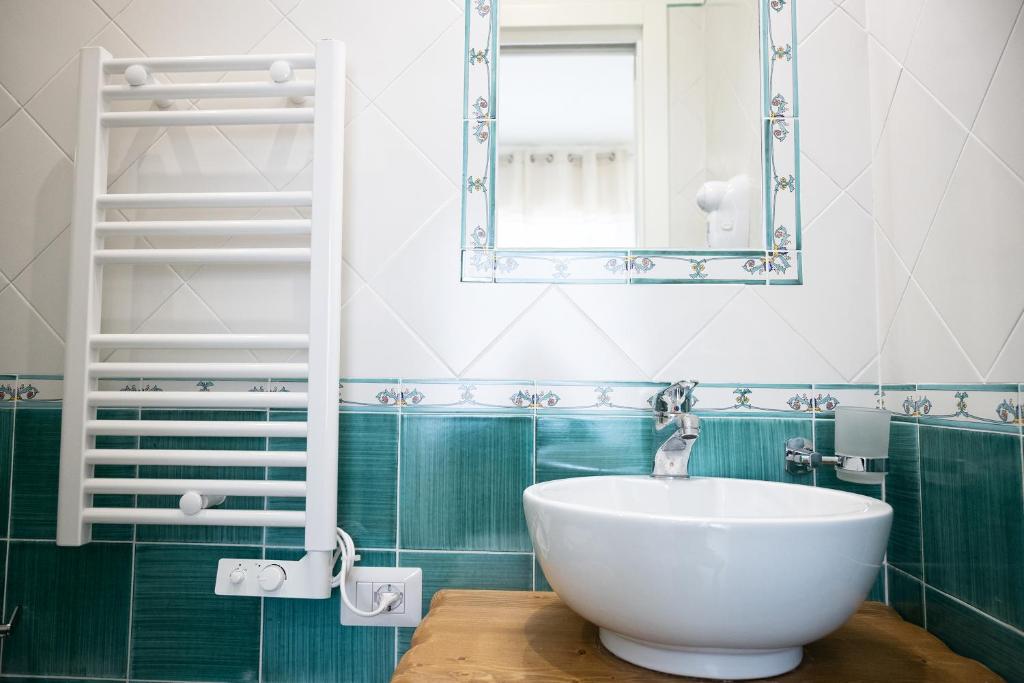 a bathroom with a white sink and a mirror at B&B DieMme Amalfi Coast in Vietri sul Mare