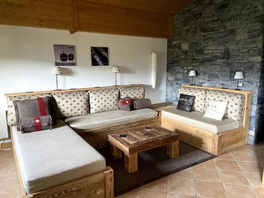 a living room with a couch and a table at Three bedroom Apartment, Samoens, Grand Massif in Samoëns