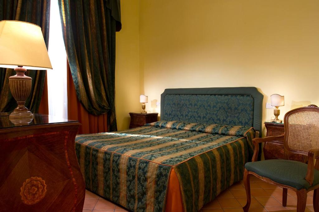 Postel nebo postele na pokoji v ubytování Chiaja Hotel de Charme