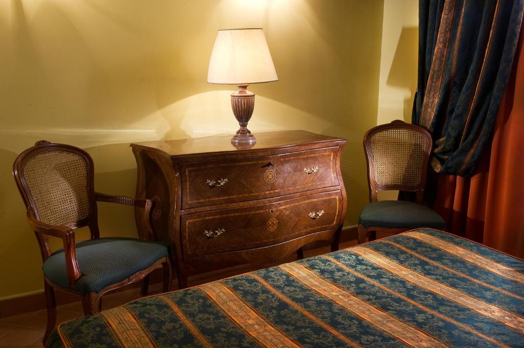 Postel nebo postele na pokoji v ubytování Chiaja Hotel de Charme