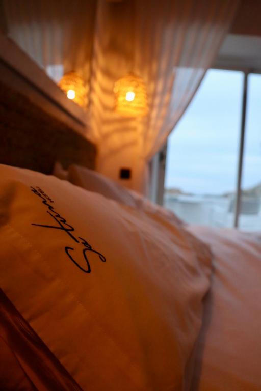 Posteľ alebo postele v izbe v ubytovaní Hotel Sa Tuna
