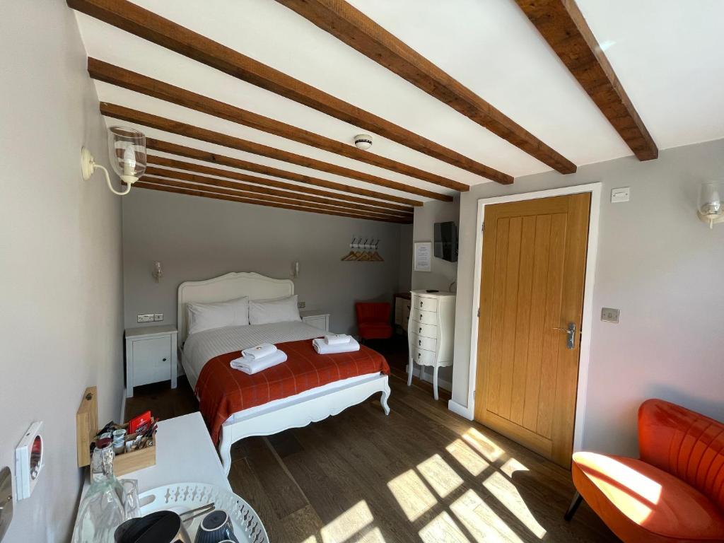 Postel nebo postele na pokoji v ubytování The Queen Matilda Country Rooms