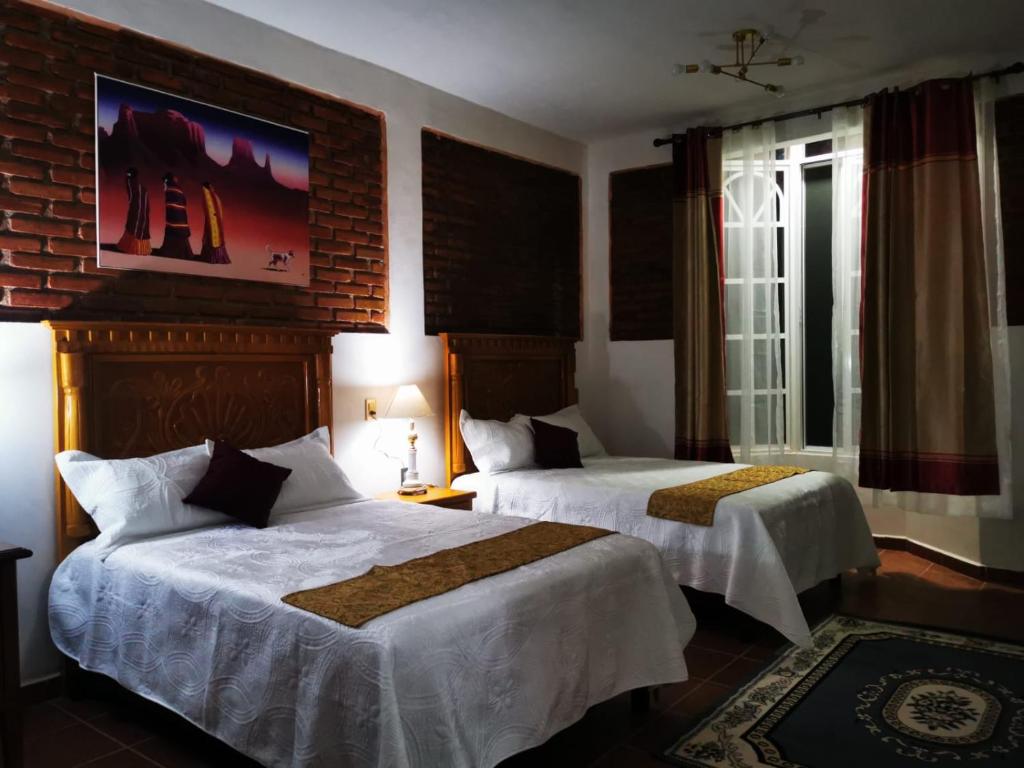 Postel nebo postele na pokoji v ubytování Hotel Boutique Casona Mashei
