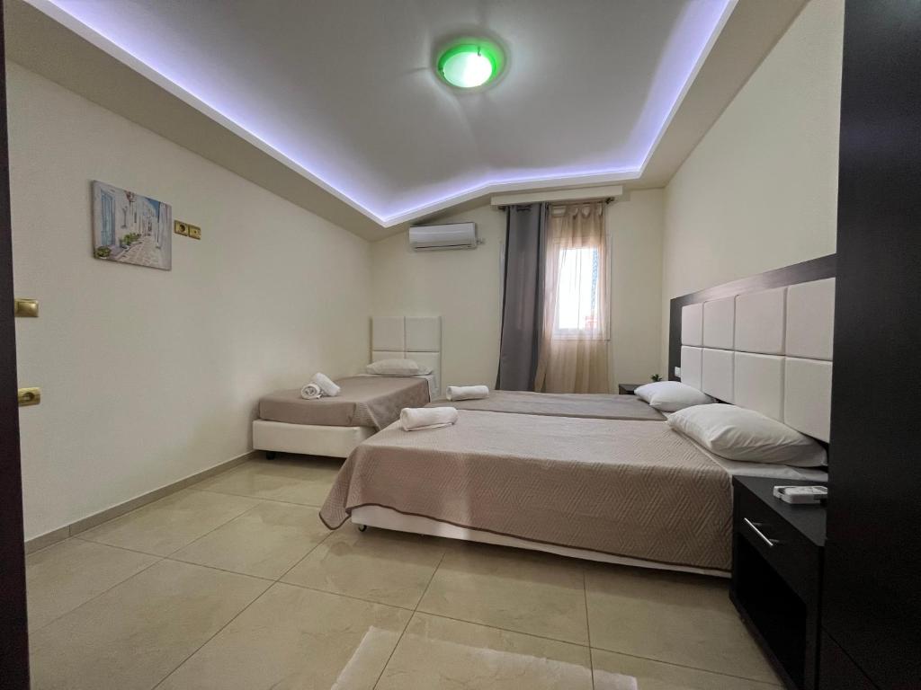 A bed or beds in a room at Anatoli deluxe house