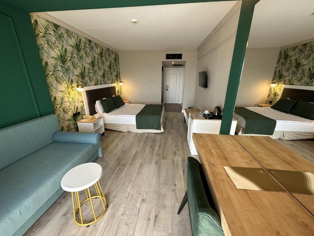 Postel nebo postele na pokoji v ubytování L'Oceanica Beach Resort
