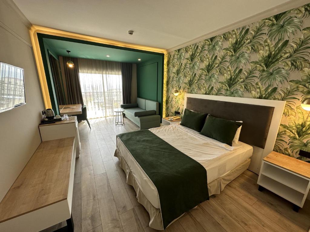 Postel nebo postele na pokoji v ubytování L'Oceanica Beach Resort