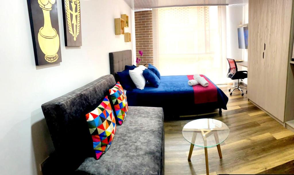 A bed or beds in a room at Nuevo Loft completo 34 Corferias Movistar Arena Campin HOST-MI