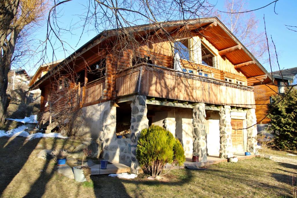 a house with a balcony on the side of it at Chalet Shaimoa in Font-Romeu-Odeillo-Via