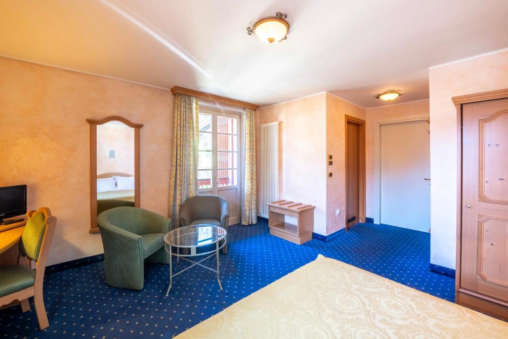 Postel nebo postele na pokoji v ubytování Hotel Relais Orsingher