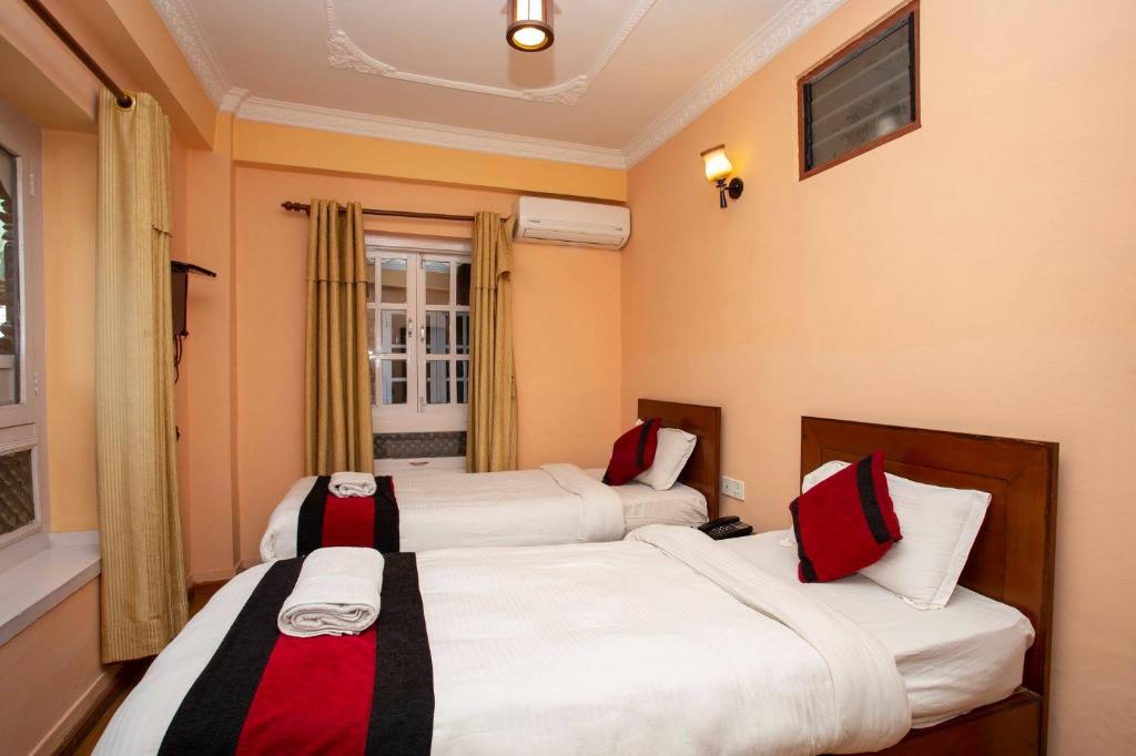 Postel nebo postele na pokoji v ubytování Hotel Mudkhu Durbar