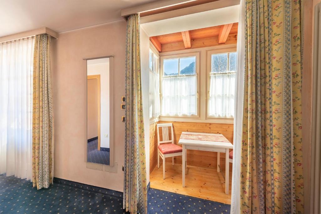 Postel nebo postele na pokoji v ubytování Hotel Relais Orsingher