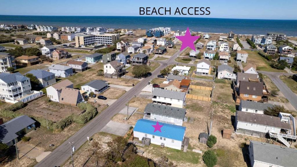 an aerial view of a small city with a pink arrow at Beach Bliss in Kill Devil Hills