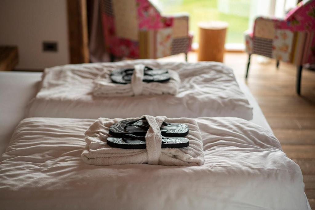 A bed or beds in a room at Casera Cornolera