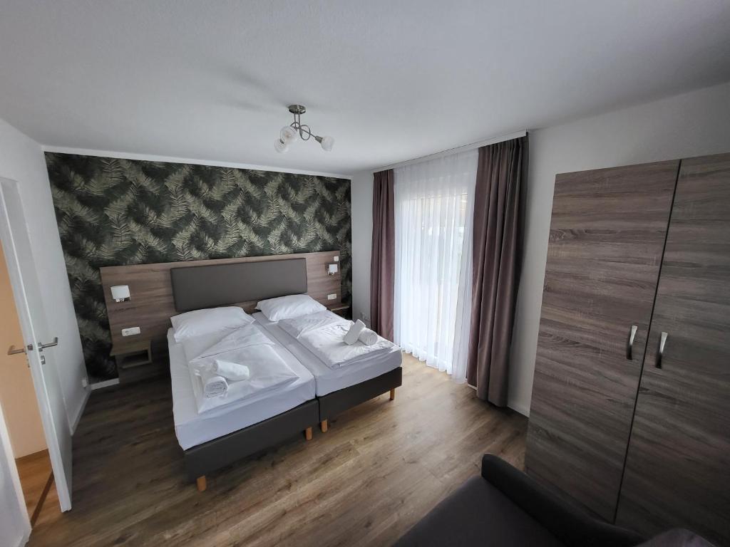 Postel nebo postele na pokoji v ubytování Hotel Dea