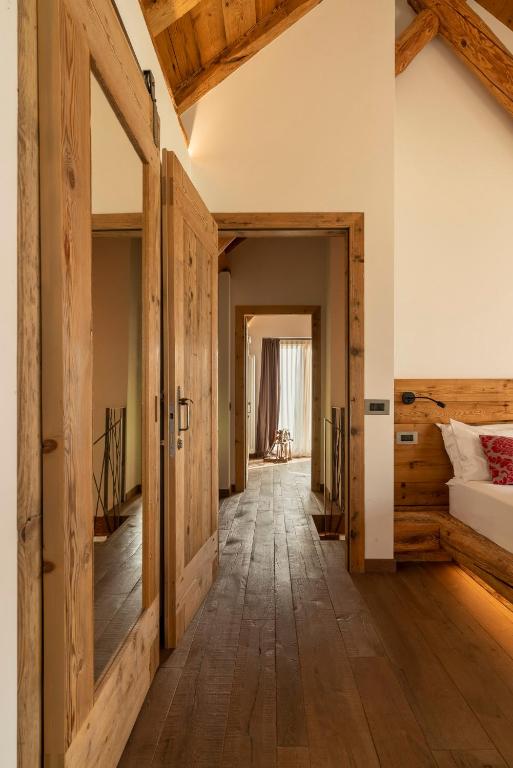 A bed or beds in a room at Casera Cornolera