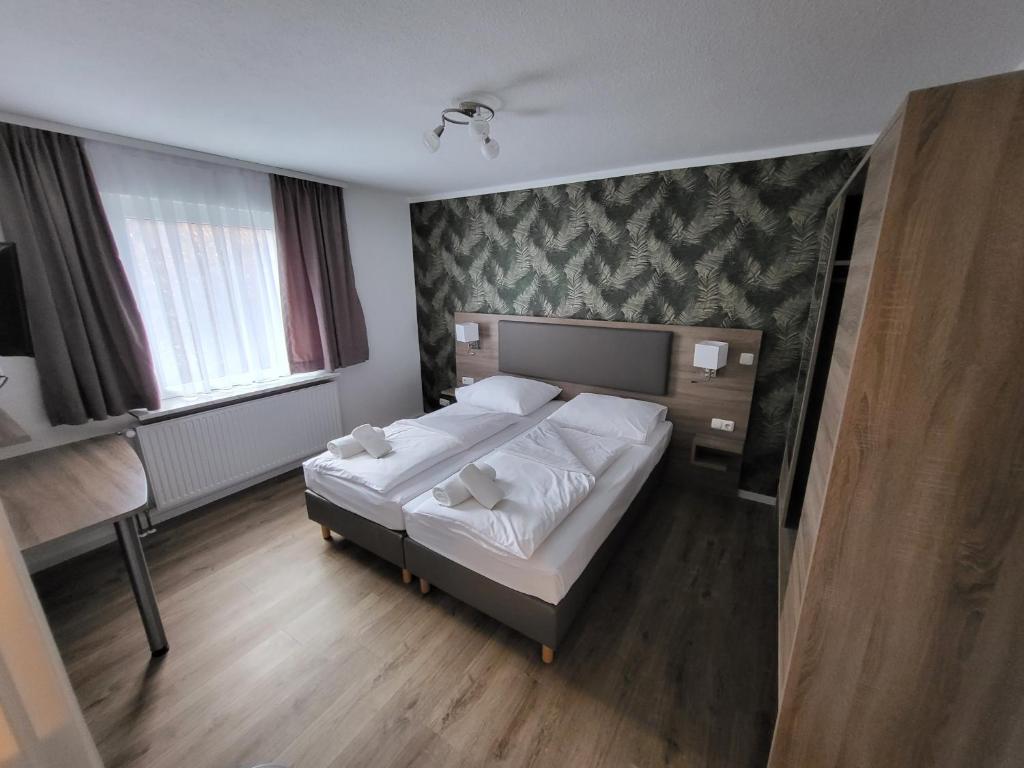 Postel nebo postele na pokoji v ubytování Hotel Dea