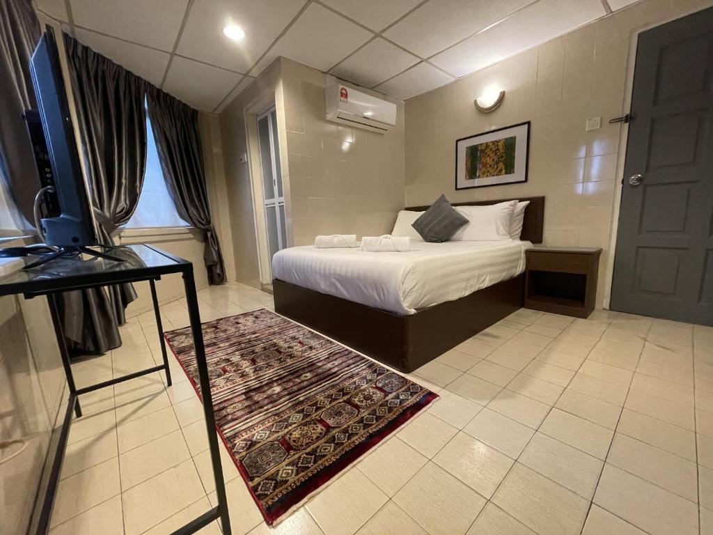 Postel nebo postele na pokoji v ubytování Barrack Street Hotel