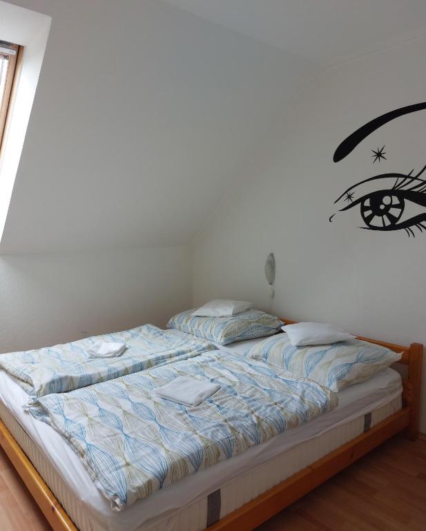 Posteľ alebo postele v izbe v ubytovaní Apartmancentrum