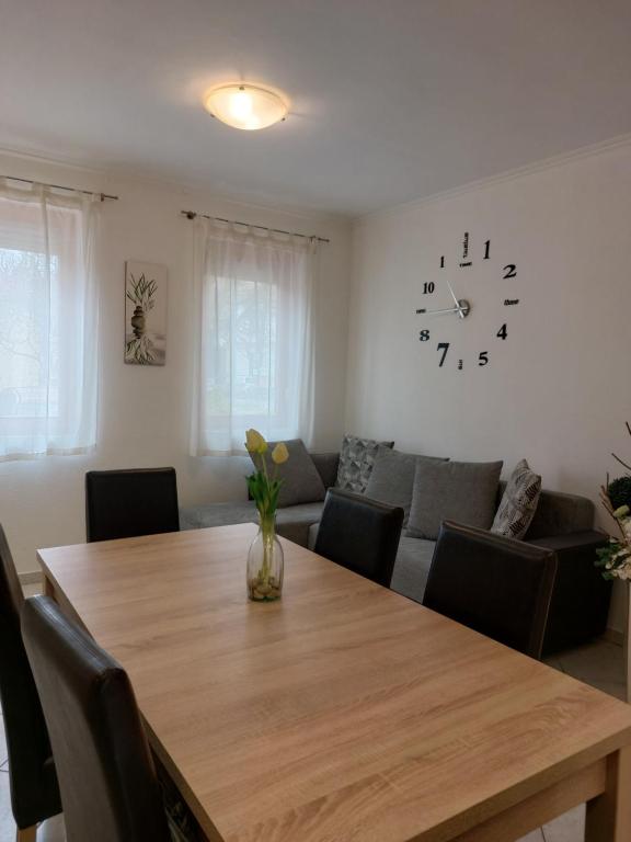 a living room with a table and a couch at Apartmancentrum in Gyula