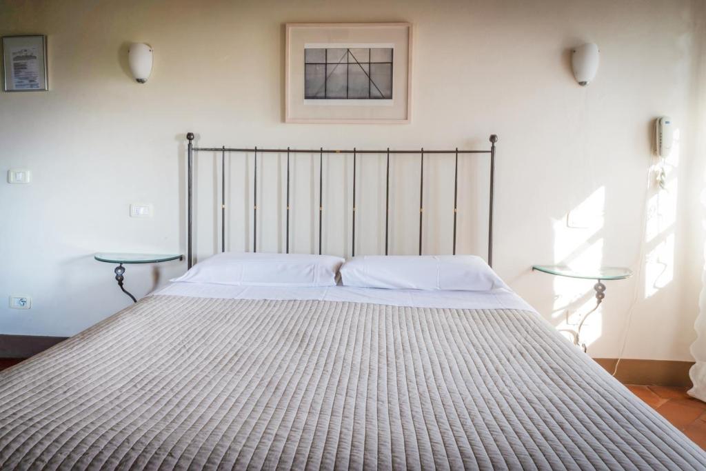 Postel nebo postele na pokoji v ubytování Albergo San Lorenzo