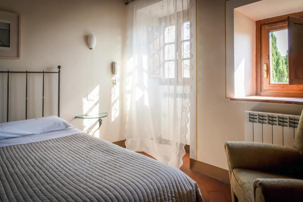 Postel nebo postele na pokoji v ubytování Albergo San Lorenzo