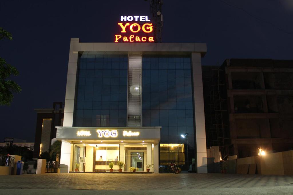 a hotel vog package sign on top of a building at Hotel Yog Palace Newly Renovated in Shirdi