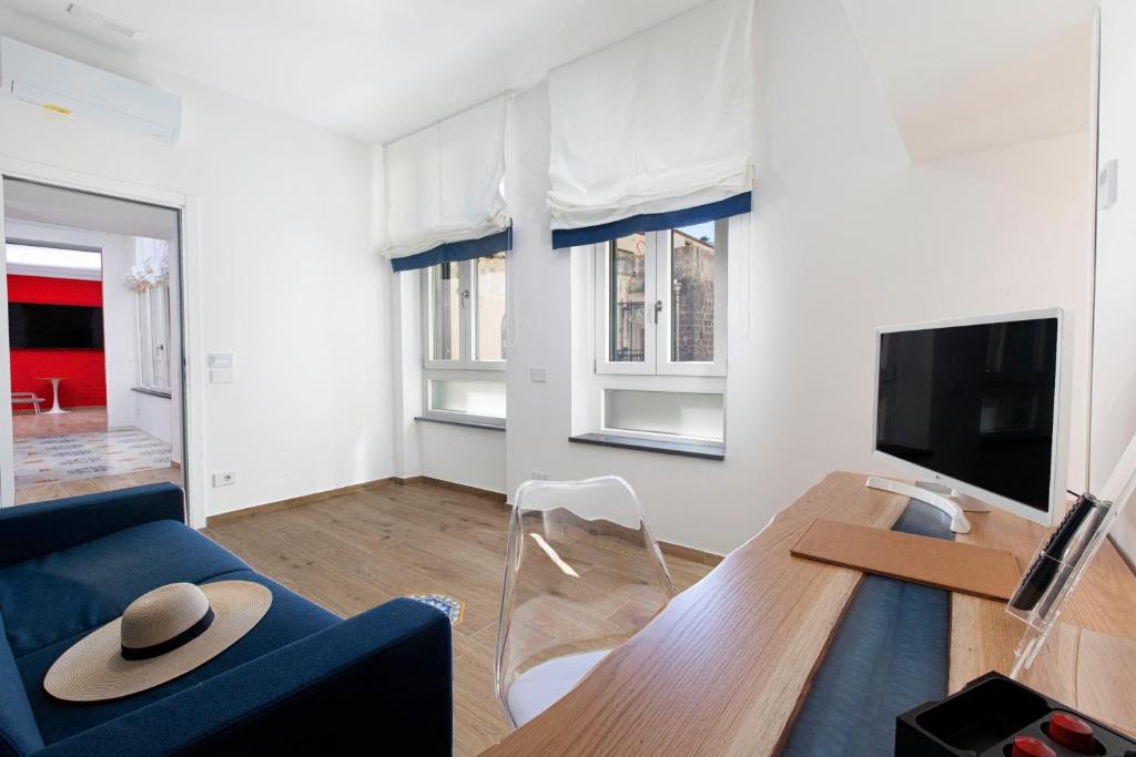 TV a/nebo společenská místnost v ubytování YourHome - Lidia Rooms & Suites