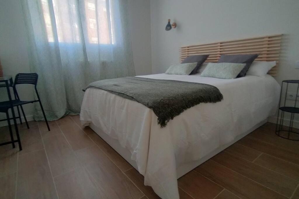 Łóżko lub łóżka w pokoju w obiekcie Apartamento Laurana