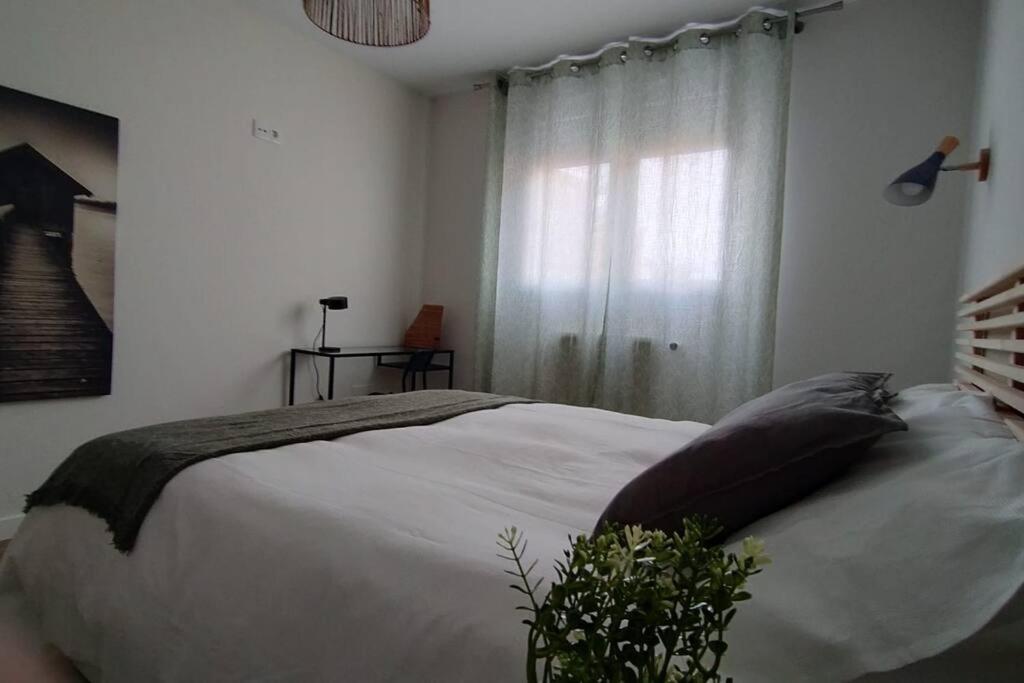 Łóżko lub łóżka w pokoju w obiekcie Apartamento Laurana