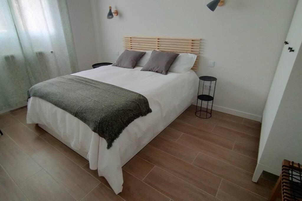 Łóżko lub łóżka w pokoju w obiekcie Apartamento Laurana