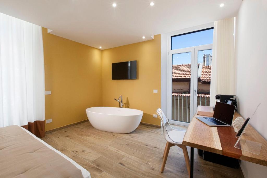 TV a/nebo společenská místnost v ubytování YourHome - Lidia Rooms & Suites