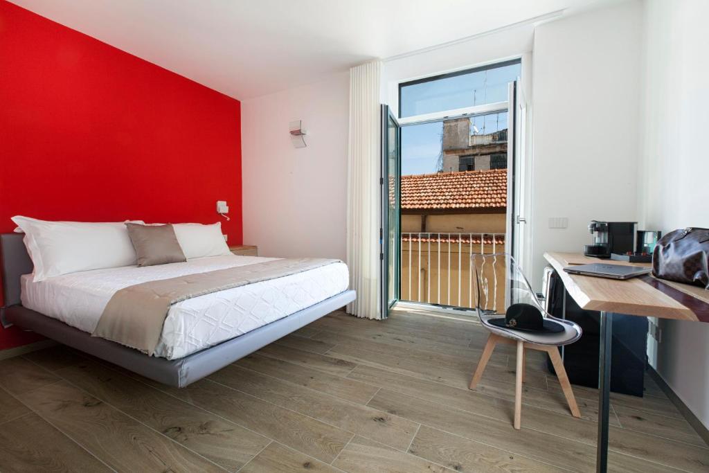 Postel nebo postele na pokoji v ubytování YourHome - Lidia Rooms & Suites