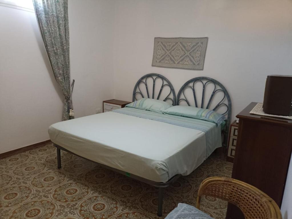 A bed or beds in a room at Appartamento Ginepro Sardegna