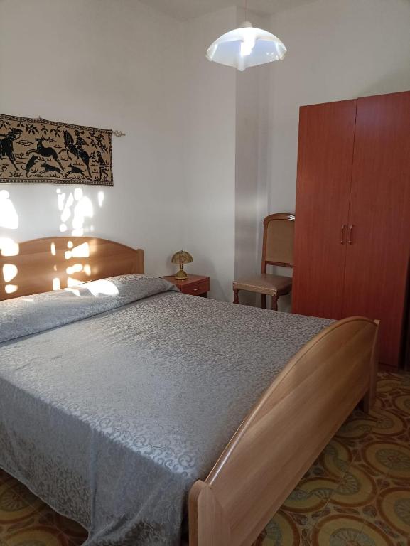 A bed or beds in a room at Appartamento Ginepro Sardegna