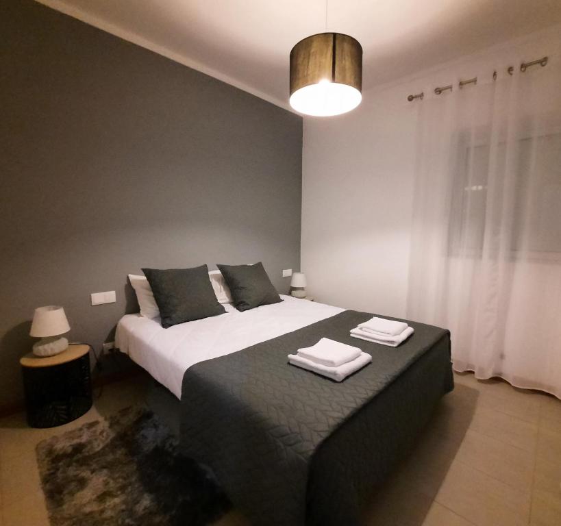 Postel nebo postele na pokoji v ubytování Vila Nova House