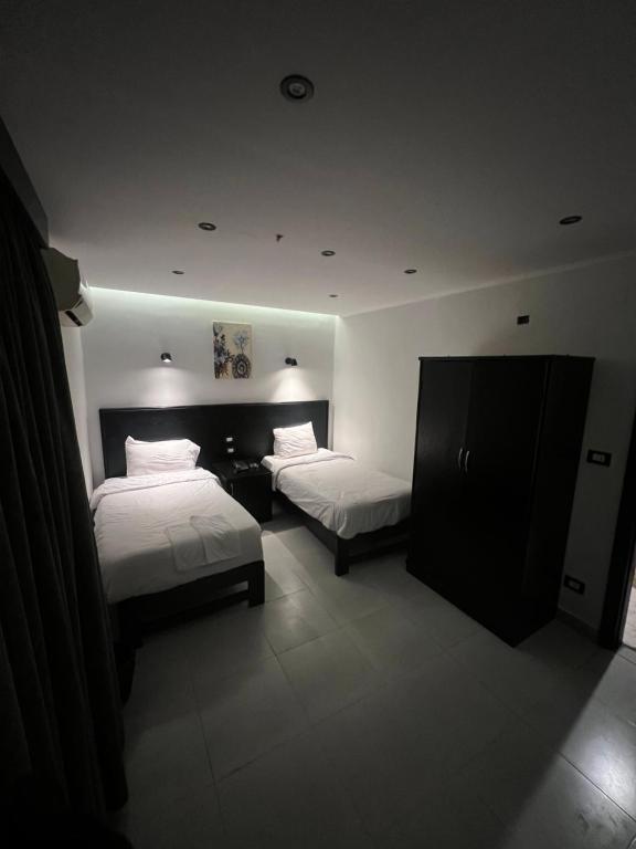 Postel nebo postele na pokoji v ubytování Helio Cairo Hotel