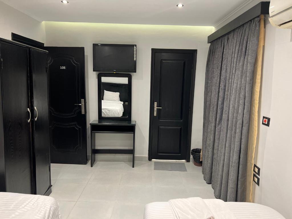 Postel nebo postele na pokoji v ubytování Helio Cairo Hotel