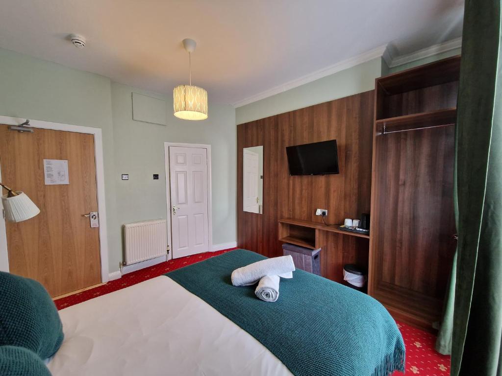Postel nebo postele na pokoji v ubytování Lyndon Guesthouse