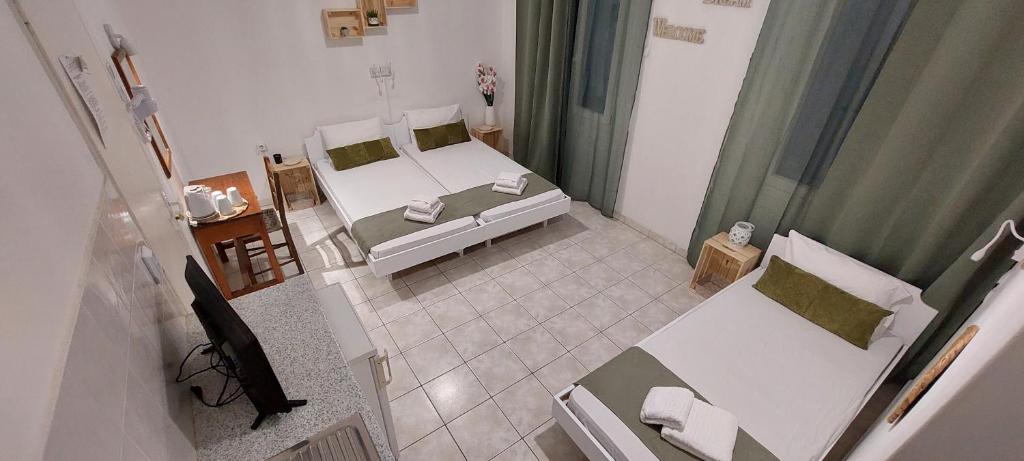 Postel nebo postele na pokoji v ubytování Kato Yialos Paros