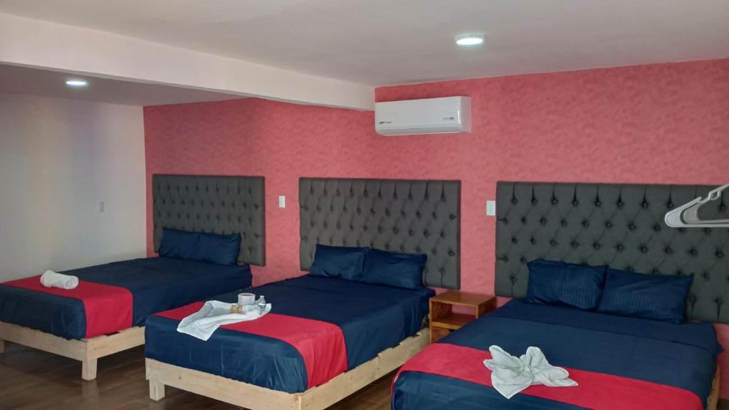 Postel nebo postele na pokoji v ubytování Hotel La Intimidad